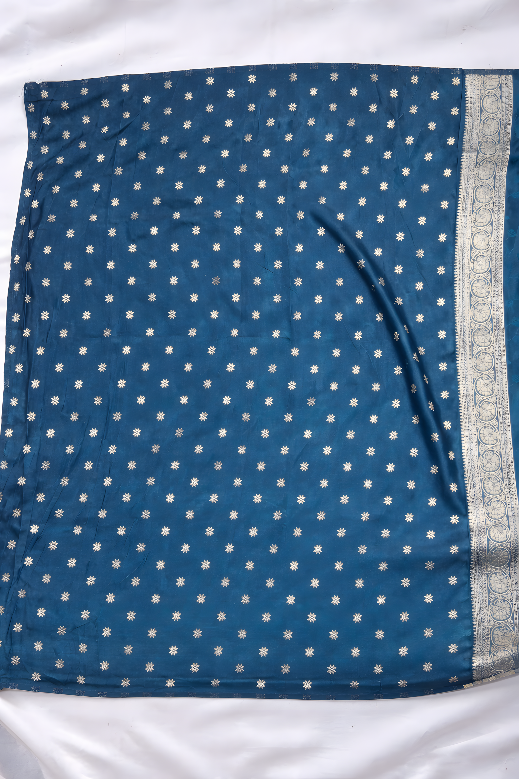 Blue fabric with white pattern on a white background