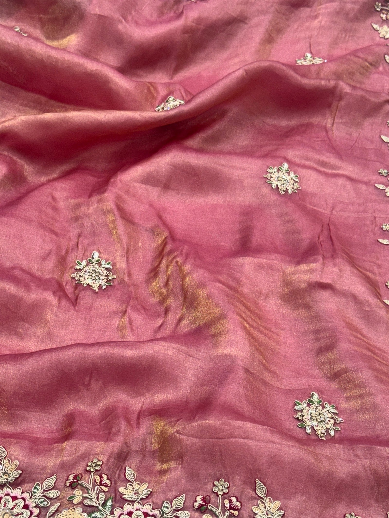 Pink fabric with floral embroidery and sequins