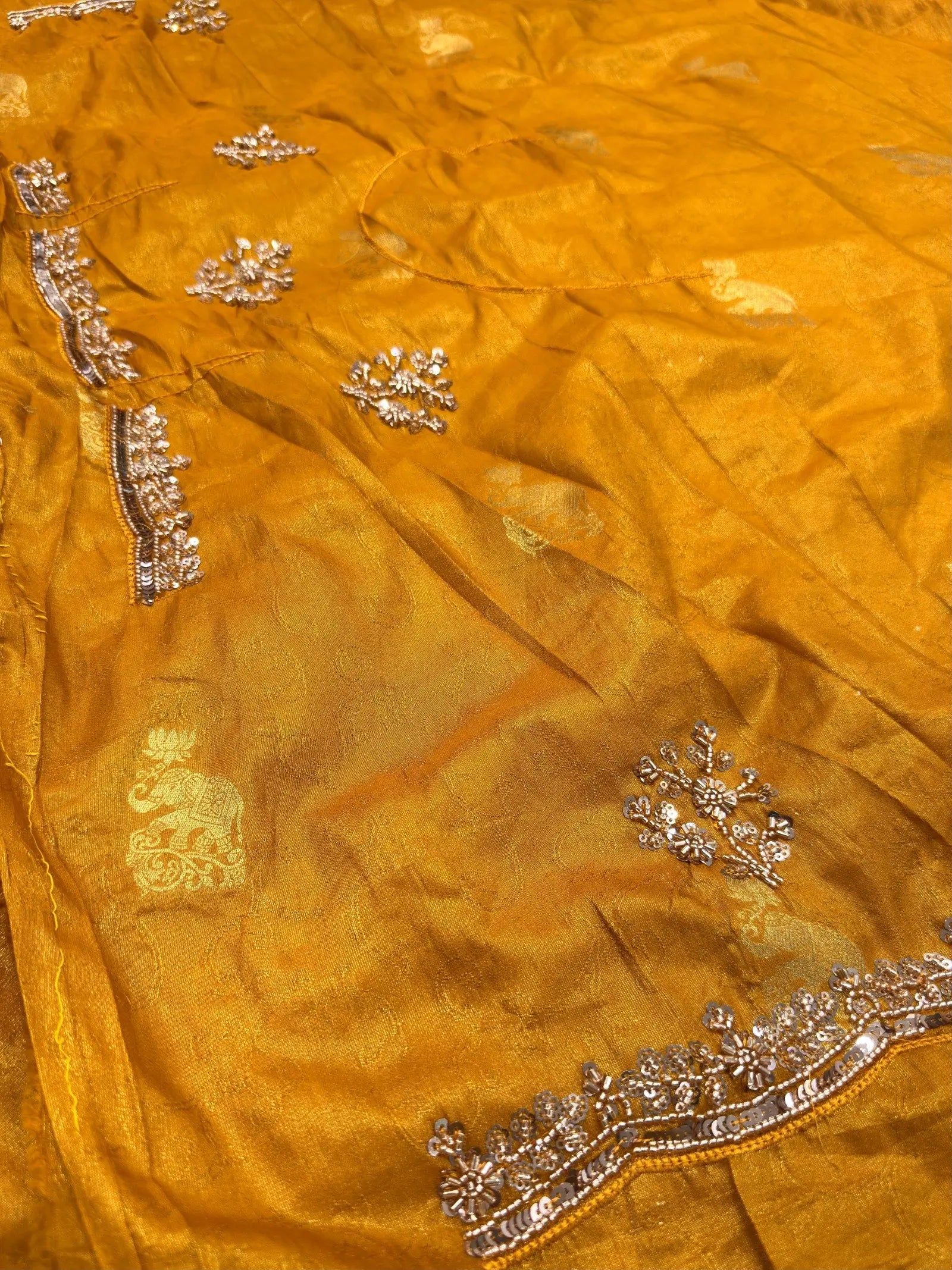 Mustard yellow Dolla silk saree fabric with zari woven elephant motifs and hand cutdana sequin border detail