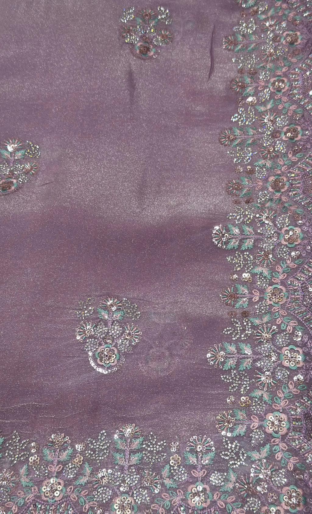 Purple fabric with intricate silver and gold embroidery