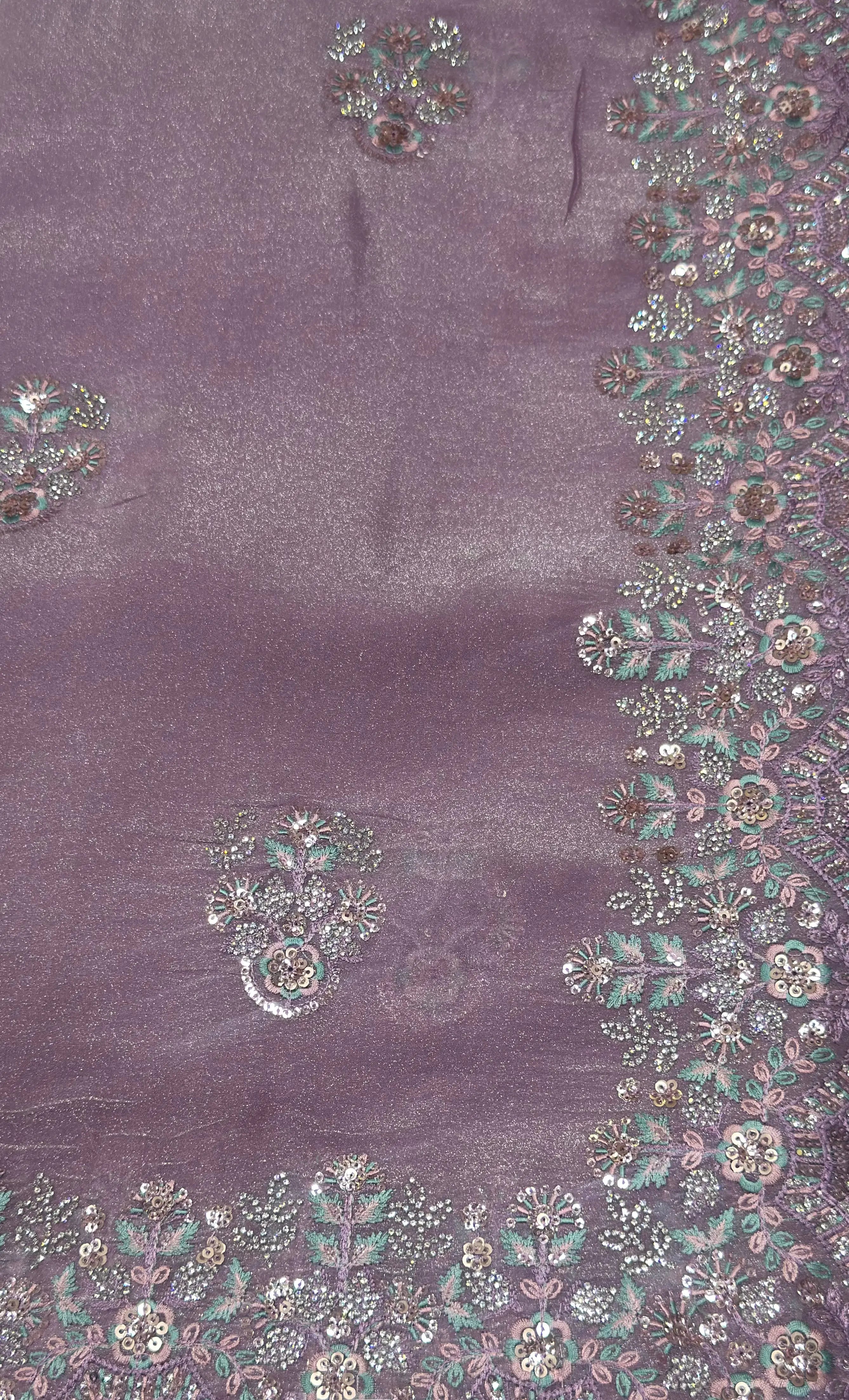 Purple fabric with intricate silver and gold embroidery