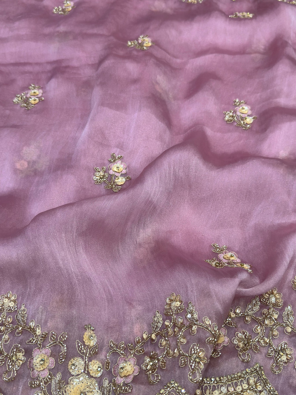 pink fabric with gold floral embroidery