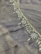 Decorative lace trim on a dark fabric background