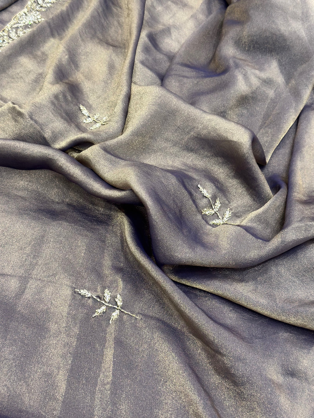 Gray fabric with floral embroidery